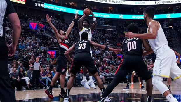 Utah Jazz forward Taylor Hendricks (0) shoots from the key above Portland Trail Blazers forward Toumani Camara (33) in the second half at Delta Center.